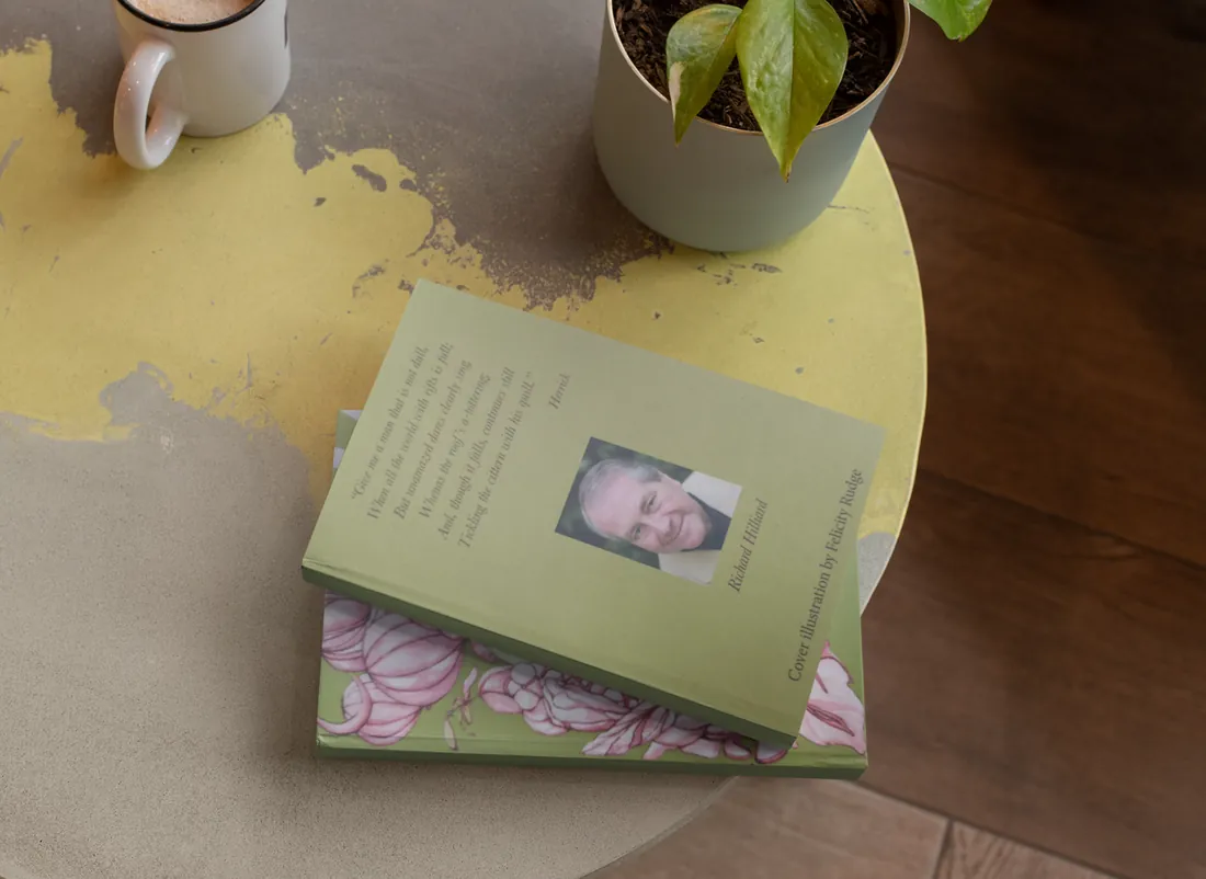 The back cover of Plenty of Grapes, showing Richard Hilliard's photograph and a verse by Herrick, on a table beside a plant